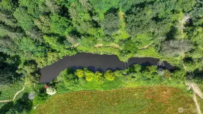 Kayak-able pond for recreating, hosts a gazebo and trail system around the perimeter.
