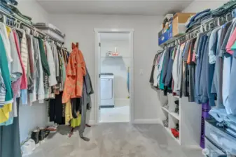 Pass through walk-in closet with laundry room access ~
