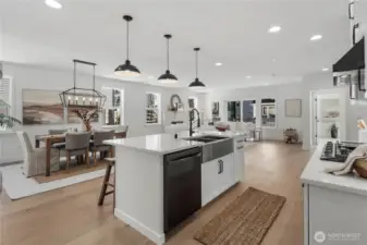 Kitchen & Living Flow: Expansive island with farmhouse sink and modern fixtures overlooks the dining and great room. This open-concept design highlights natural light and creates effortless flow for entertaining or quiet evenings at home.  Staged photos are of the model home of the same floorplan within the Foxmoore community and are for visualization purposes only. Colors, finishes, and layout can and will vary.