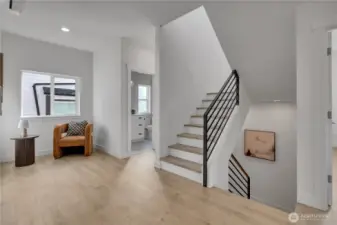 Half bath near stairs to rooftop deck.