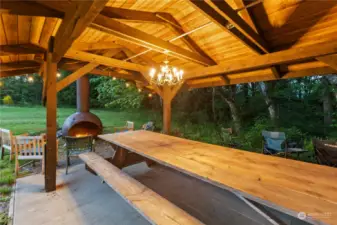 The covered cabana, picnic area, and outdoor fireplace.