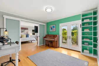 Library/flex room with built-ins provides versatility as a third bedroom on the main level.