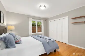 A generous second bedroom is served by a full bath