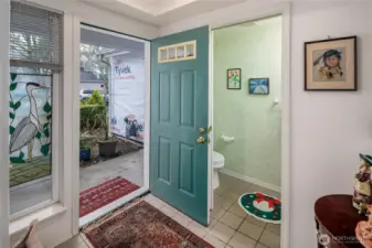 Large entry with convenient half bath.