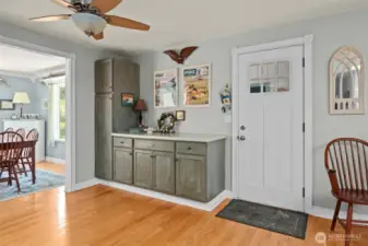 This door leads to the covered breezeway and the spacious two car garage.