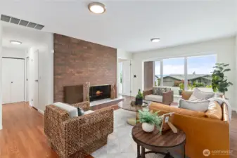 Formal Living room off of entryway with stunning fireplace perfect for warm winter nights!