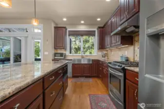 Exquisite cabinetry throughout spacious kitchen...