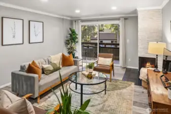 Living room has a large partially covered patio with storage attached.
