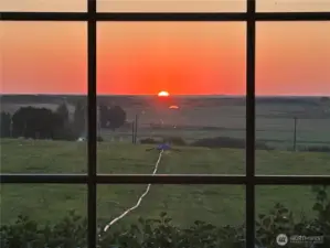 Morning sunrise and eastern view.  Extra bonus is you get to watch the moon rise also.  Photo shows approx 8 acres in orchard grass and 1/4 mile wheel line.  Irrigation equipment is included.