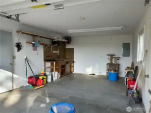 Interior of single side of garage.  Finished for shop with heat and power.