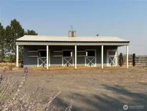 20x40 Horse barn.  Three stalls and tack/storage room.  Barn has power and water with corral opening to the 8 acre pasture.