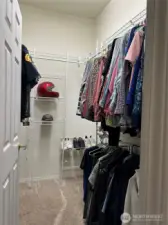 Primary bedroom walk in closet