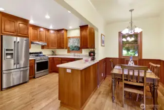 The spacious farm-style kitchen has been updated and includes an eating area