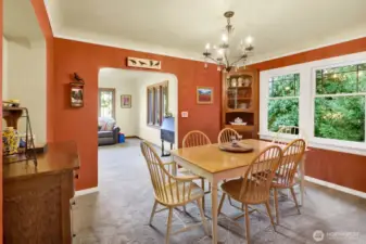 The dining room is between the kitchen and great room and features original built-in cabinets
