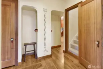 Original features like the beautiful hardwood floors and this cubby that used to house the telephone, remain