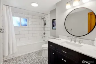 The main floor features a newly updated full bathroom