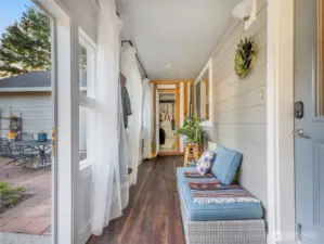 Walk into a sun room as you enter the home. This area is great for protection from the weather, storage and plants.