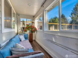 Walk into a sun room as you enter the home. This area is great for protection from the weather, storage and plants.