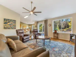 Large great room with vaulted ceilings and ample natural light.