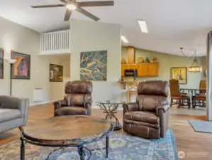 Large great room with vaulted ceilings and ample natural light.