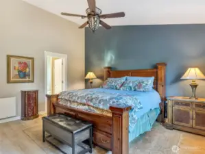 Primary bedroom suite with attached bathroom and walk-in closet.