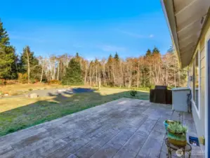 Back patio with stamped concrete pavers.