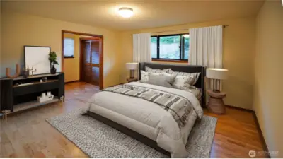 Upstairs primary bedroom, virtually staged to show scale.