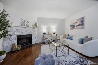 living room with wood burning fireplace
