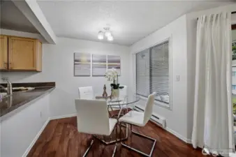 dining room window faces north. Sliding door to patio behind drape