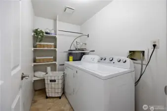 Full size laundry with storage.