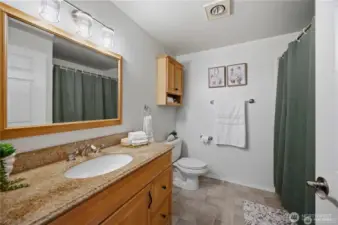 Bath with tub and shower.