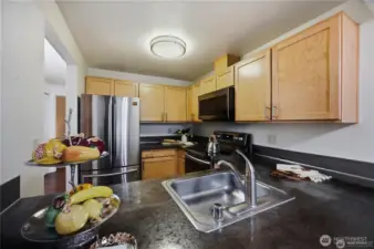Kitchen looking from dining room. Stainless steel applicances
