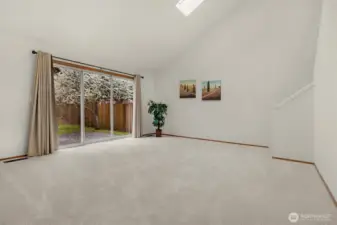 Huge main floor bonus room with sliders out to the patio and back yard