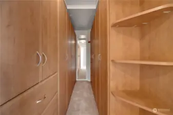 Primary closet has built-in cabinet system.