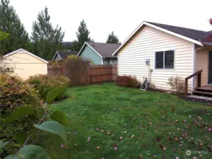 Fully fenced backyard and storage shed