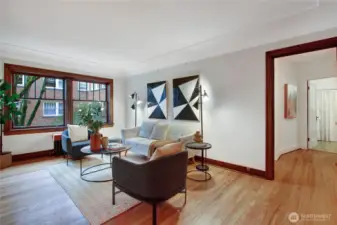 Living room with view of hallway to bedroom and bathroom.