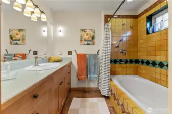 Colorful primary bath! Your toes will love the radiant heat floors!
