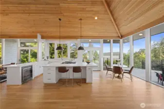 Beautiful hardwood floors and walls of windows looking to the lake give a coastal contemporary elegance to the home.