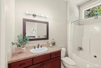 The updated lighting and large window above the shower provide excellent lighting!