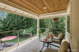 Off the upstairs living room is this covered deck!