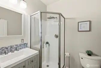 Efficient 3/4 bathroom off the upstairs primary bedroom.