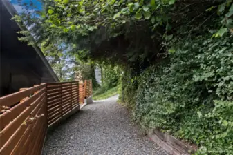 Walk up path and land is on the left.