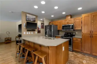 kitchen bar dining area.  Kitchen cabinets are equipped with pull out shelves for added convenience.