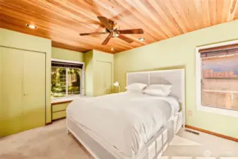 The primary ensuite offers window seating as well a private entrance to the deck.