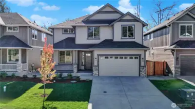 Beautifully designed new home from local, experienced northwest builder BI Homes, Inc. includes durable Hardi brand siding and accents, stone garage and post accents, an inviting front porch with energy efficient fiberglass entry door and vinyl clad windows.  Plus sod lawn with an included irrigation system.