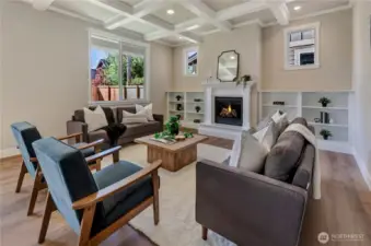 Spacious in size, this great room includes a natural gas log fireplace with custom painted mantle and bookshelves.
