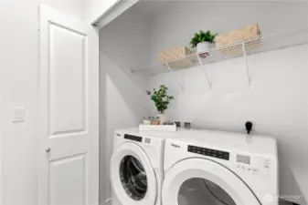 Side-by-side laundry conveniently located on the upper floor