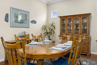 Formal dining has windows to covered patio