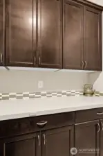 Custom cabinets in laundry for extra storage.