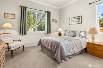 Guest suite with full bathroom is at opposite side of house from primary